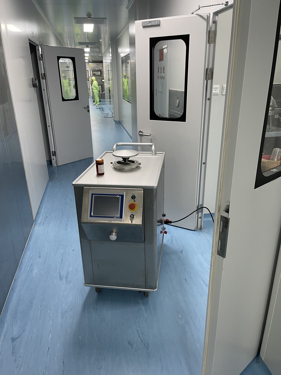 Mobile VHP generator positioned at the airtight door of a cleanroom