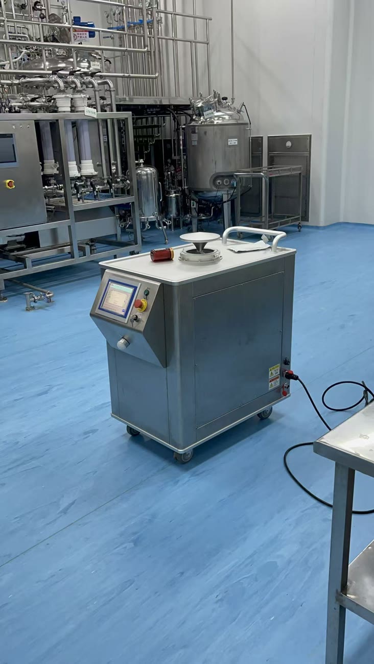 Mobile VHP generator with touchscreen standing in a pharmaceutical production area